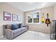 Comfortable living room with stylish decor, a soft couch, and guitars hanging on the wall at 3711 Pete Dye Blvd, Carmel, IN 46033