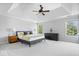 Main bedroom suite with tray ceiling, ceiling fan, and double windows at 3711 Pete Dye Blvd, Carmel, IN 46033