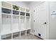 Functional mudroom with built-in storage cubbies, hooks, and a convenient entry door at 3711 Pete Dye Blvd, Carmel, IN 46033