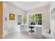 Bright home office with large windows, neutral walls, and ample desk space for productivity at 3711 Pete Dye Blvd, Carmel, IN 46033