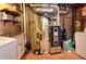 Basement utility area featuring washer, dryer, sink, storage, and exposed duct work at 3903 Junco Cir, Indianapolis, IN 46228