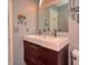 Bright bathroom with a double sink vanity and a large framed mirror at 3903 Junco Cir, Indianapolis, IN 46228