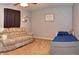 Cozy bedroom featuring a sofa, a twin bed, and neutral wall decor at 3903 Junco Cir, Indianapolis, IN 46228
