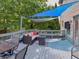 Inviting backyard deck with comfortable seating, dining area, and stylish sunshades at 3903 Junco Cir, Indianapolis, IN 46228