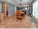 Dining area with room for the whole Gathering, with plenty of natural light from the sliding glass door at 3903 Junco Cir, Indianapolis, IN 46228