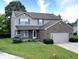 Charming two-story home with brick and siding, plus a well-kept lawn and landscaping at 3903 Junco Cir, Indianapolis, IN 46228