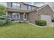 Charming home featuring brick accents, a well-manicured lawn, and blue shutters at 3903 Junco Cir, Indianapolis, IN 46228