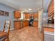 Spacious kitchen boasting stainless steel appliances, oak cabinets, and a tile backsplash at 3903 Junco Cir, Indianapolis, IN 46228