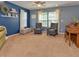 Inviting living room featuring neutral carpet, contemporary gray seating, and a light-filled window at 3903 Junco Cir, Indianapolis, IN 46228
