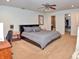Tranquil main bedroom with neutral carpet and a comfortable gray upholstered bed at 3903 Junco Cir, Indianapolis, IN 46228
