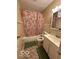 Bathroom with patterned shower curtain, vanity, and a tile floor at 4014 Arquette Dr, Indianapolis, IN 46235