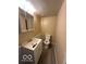 Standard bathroom with toilet, sink, and vanity at 4014 Arquette Dr, Indianapolis, IN 46235
