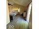 Vaulted ceiling, main bedroom with wood floors, and sliding glass door at 4014 Arquette Dr, Indianapolis, IN 46235
