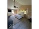 Vaulted ceiling, main bedroom with wood floors, and vaulted windows at 4014 Arquette Dr, Indianapolis, IN 46235