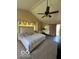 Spacious main bedroom featuring a ceiling fan, ensuite, and natural light at 4014 Arquette Dr, Indianapolis, IN 46235