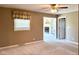 Cozy bedroom with carpet, a window, and an en-suite fireplace at 4680 Cartersburg Rd, Plainfield, IN 46168