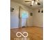 Bedroom featuring hardwood floors, a window, and neutral walls at 4680 Cartersburg Rd, Plainfield, IN 46168