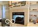 Cozy fireplace with mantel and built-in shelving, perfect for displaying decor at 4680 Cartersburg Rd, Plainfield, IN 46168