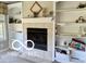 Inviting fireplace with mantel and built-in shelving units at 4680 Cartersburg Rd, Plainfield, IN 46168