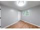 Bright bedroom with ample natural light, neutral paint and hard surface floors at 5512 Lunsford Dr, Indianapolis, IN 46237