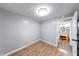 Bedroom with a bathroom featuring neutral paint and light wood floors at 5512 Lunsford Dr, Indianapolis, IN 46237