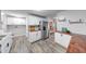 Spacious kitchen featuring white cabinets, wood countertops, and stainless steel refrigerator at 5512 Lunsford Dr, Indianapolis, IN 46237