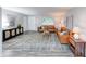 Open living room with neutral walls, modern decor, a stylish rug, and hardwood-style flooring at 5512 Lunsford Dr, Indianapolis, IN 46237