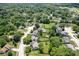 Aerial shot showing a residential area with tree-filled yards, community layout, and nearby recreational areas at 5640 Dapple Ct, Indianapolis, IN 46228
