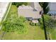 Aerial view capturing the backyard, featuring lush greenery, trees, deck, and home's architecture at 5640 Dapple Ct, Indianapolis, IN 46228