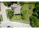 An aerial view shows the roof and backyard, including a trampoline and playground set at 5640 Dapple Ct, Indianapolis, IN 46228