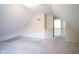 Spacious carpeted attic with pitched ceiling and natural light at 5640 Dapple Ct, Indianapolis, IN 46228