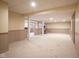 Finished basement rec room area with ample open space and utility poles at 5640 Dapple Ct, Indianapolis, IN 46228