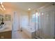 Large primary bathroom includes a tub, shower, and double sink at 5640 Dapple Ct, Indianapolis, IN 46228