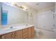 Full bathroom with a double sink vanity, and a shower-tub combo at 5640 Dapple Ct, Indianapolis, IN 46228