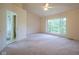 Bedroom featuring a large picture window, ceiling fan, and attached bath at 5640 Dapple Ct, Indianapolis, IN 46228