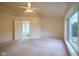 Spacious bedroom with a ceiling fan and a doorway to the bathroom at 5640 Dapple Ct, Indianapolis, IN 46228