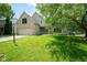 Charming brick two-story home with well-maintained lawn, blue front door and two car garage at 5640 Dapple Ct, Indianapolis, IN 46228