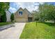Charming brick two-story home with well-maintained lawn and attached two car garage at 5640 Dapple Ct, Indianapolis, IN 46228