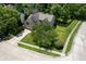 An aerial view of the home shows the partial brick facade and a well-kept lawn with mature trees at 5640 Dapple Ct, Indianapolis, IN 46228