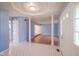 Bright foyer featuring light blue walls, unique tile flooring and decorative columns at 5640 Dapple Ct, Indianapolis, IN 46228