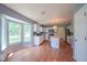 Bright and airy kitchen with a bay window, white cabinets, stainless steel appliances and center island at 5640 Dapple Ct, Indianapolis, IN 46228