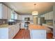 Bright kitchen features stainless steel appliances, light colored cabinets, and an island perfect for cooking at 5640 Dapple Ct, Indianapolis, IN 46228