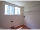 Laundry room featuring wood-look flooring and wire shelving at 5640 Dapple Ct, Indianapolis, IN 46228