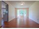 Bright living room with hardwood floors and a bay window, offering ample natural light and charm at 5640 Dapple Ct, Indianapolis, IN 46228