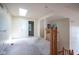 Upstairs hallway with a stairway, skylight, and entry doorway at 5640 Dapple Ct, Indianapolis, IN 46228