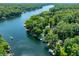 Breathtaking aerial shot of a lake community with winding waterways surrounded by dense forests at 6254 Grosbeak Ct, Nineveh, IN 46164