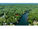 Panoramic aerial view of lakefront homes nestled within a dense forest at 6254 Grosbeak Ct, Nineveh, IN 46164