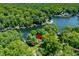 An aerial shot features a wooded lake area, highlighting homes with private docks for boating at 6254 Grosbeak Ct, Nineveh, IN 46164