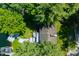 Aerial view of a property with wooded area, the roof, and dock on the lake at 6254 Grosbeak Ct, Nineveh, IN 46164