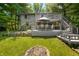 Beautiful backyard with a spacious deck, stone accents, and cozy seating area at 6254 Grosbeak Ct, Nineveh, IN 46164
